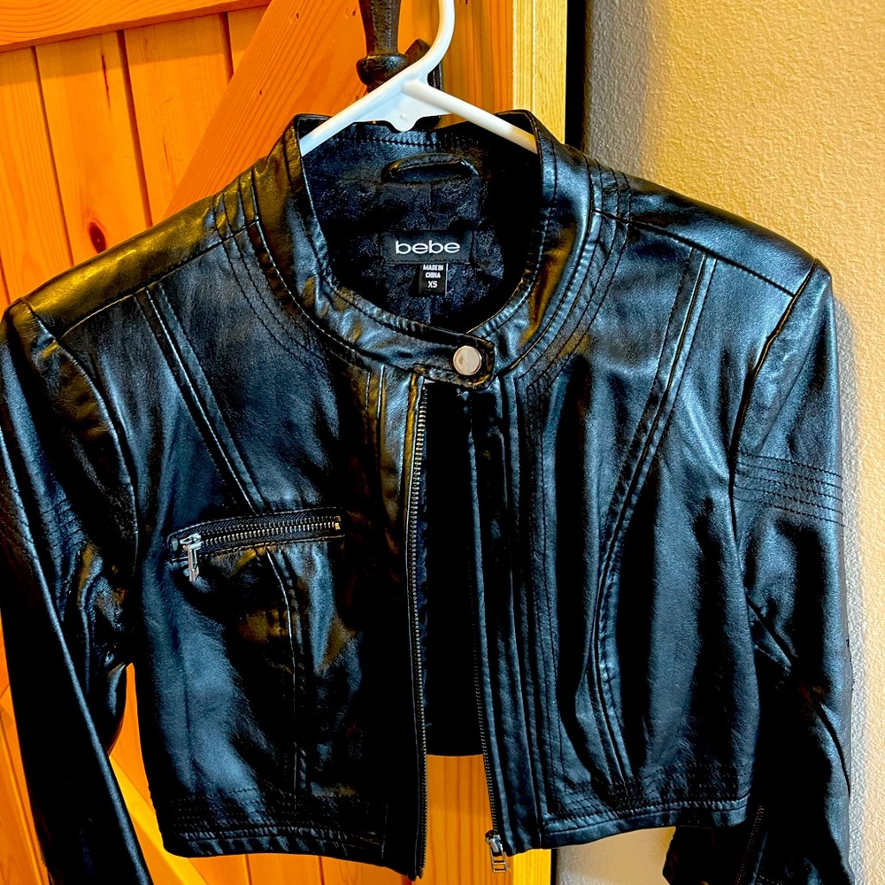 BEBE Cropped leather jacket with 3/4 sleeves.